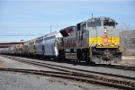 Eastbound grain train trails a heritage beaver